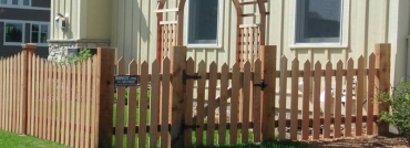 Traditional Topped Cedar Picket Fence with Arbor