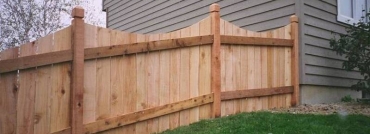 High Solid Board Scalloped Cedar Privacy Fence and Topped Posts